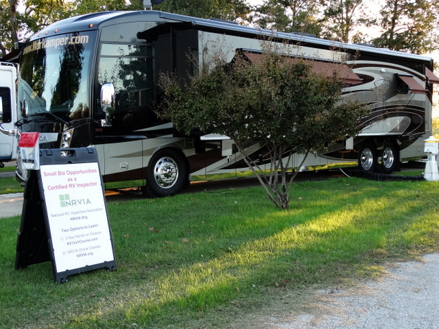 The Workamper.com RV and the sign board advertising the course
