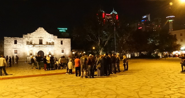 We waited outside the Alamo.  You can see the Tower of the Americas on the far right. 