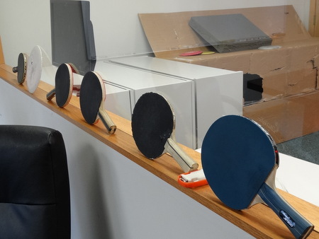 Ping pong paddles in the conference room