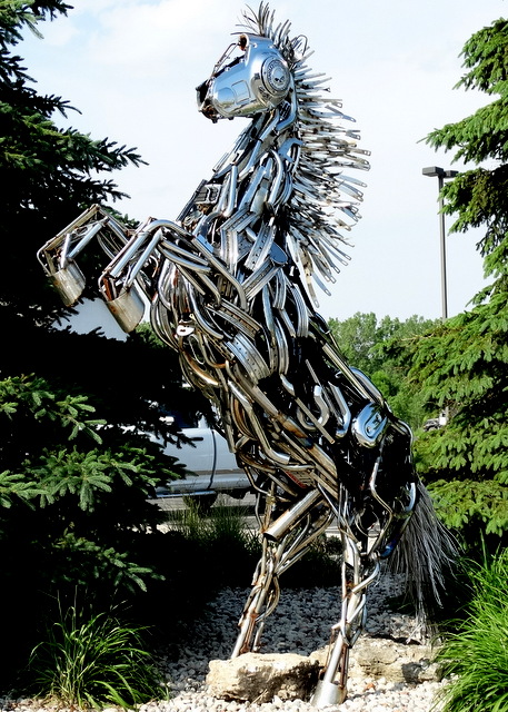 This horse sculpture, made from Harley parts, is in front of the Harley store.
