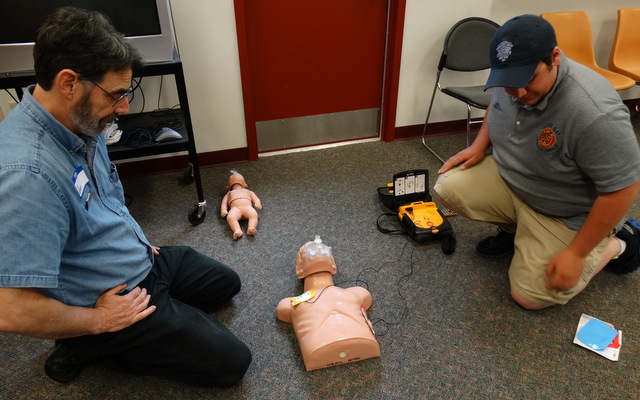 Learning how to use an AED (Automated Electronic Defibrillator)