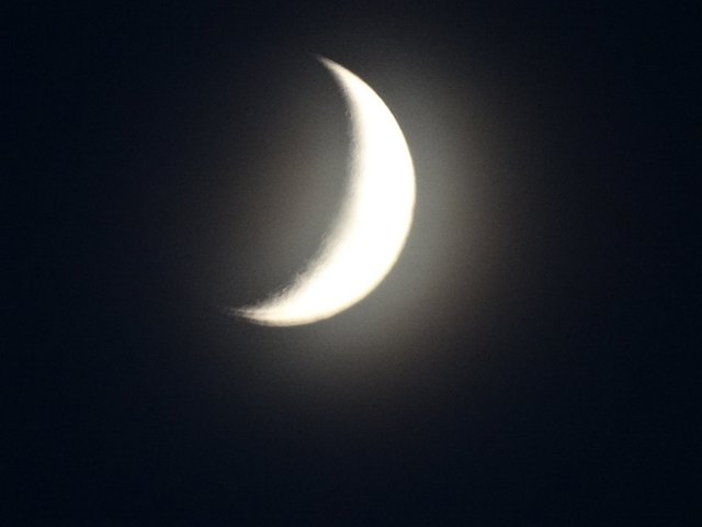 A sliver of moon was out.