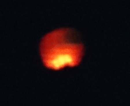 While we were waiting we kept seeing these orange blobs coming from the opposite shore and slowly drifting through the air heading east.  I took this shot with my telephoto to try to figure out what it was.  Mark said it looks like some sort of miniature hot air balloon.