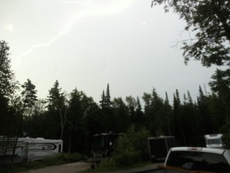 That may look like the shiny edge of a cloud, but it's a lightning bolt through rain!