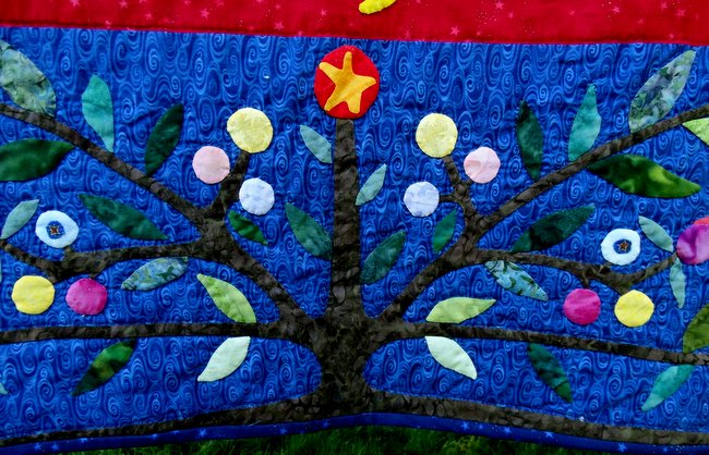 Here is a detailed shot of the applique work on that quilt.