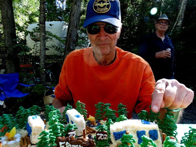 Fritz pointing to his RV on the cake.