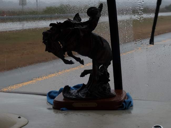 As we were driving along this morning I suddenly realized that our dashboard was wet.  Then I noticed that Mark's horse statue was dripping.  I pulled the statue away from the windshield and discovered that water was bubbling up from the base of the windshield.  It's never done that before.  I put a towel there to slow it down a bit.  When we stopped, Mark discovered that the molding outside is coming up in that area.  Not quite sure what to do about that yet.