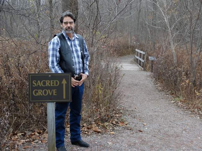 Mark at the entrance to the Sacred Grove