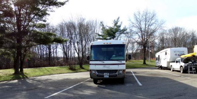 If you look closely at the camper over one from us, you'll see a man's legs sticking out of the engine. He seemed to be tearing his engine apart. :-)