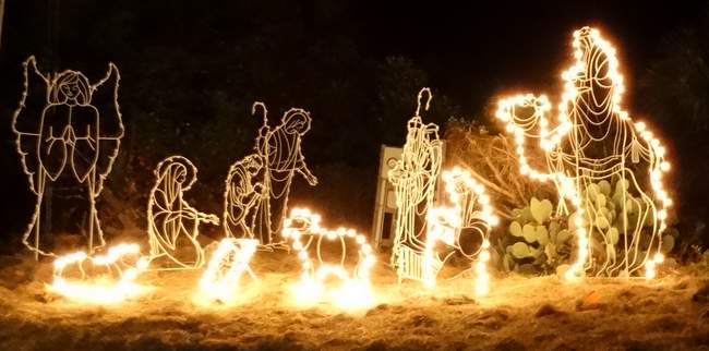 A nativity...But just like folks who only bring out a few pieces each week of Advent, only the magi and animals are currently lit.