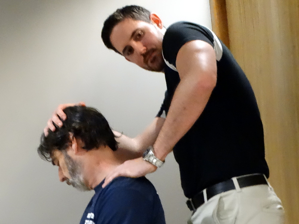 This is a brand new (just got his license) chiropractor working on Mark in the Wellness Center