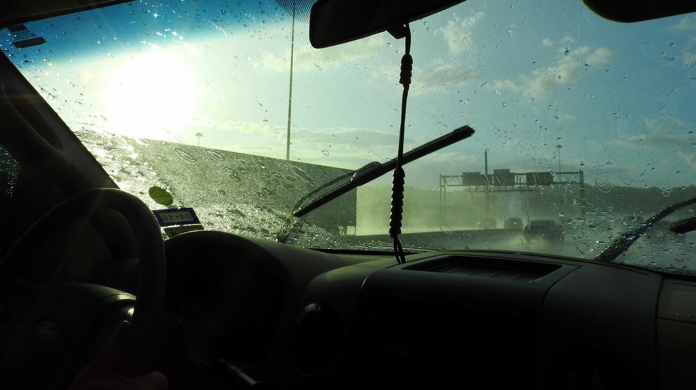 We stopped to get gas and wash our windows, and no sooner had we pulled onto the highway again when it started raining just over the highway.  Blue sky and sun everywhere else!