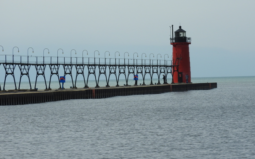 There are two really long piers out into the lake that form a safe entrance into South Haven for boats.  This pier is on the south beach and has a lighthouse.  It emits kind of a steady golden light at night.