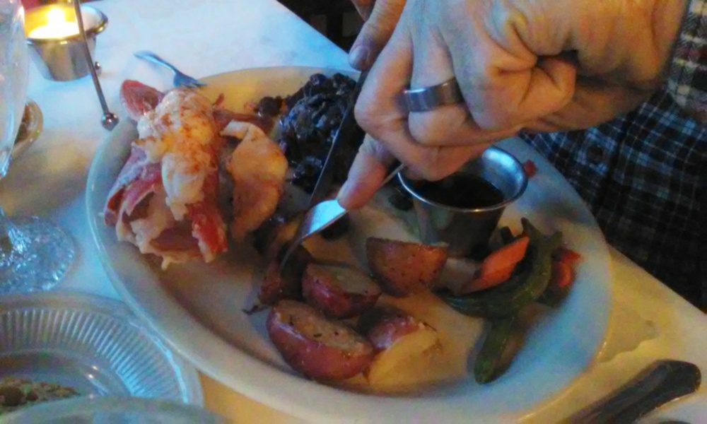 Mark had the surf and turf -- lobster and steak smothered in mushroom sauce with red potatoes and vegetables.