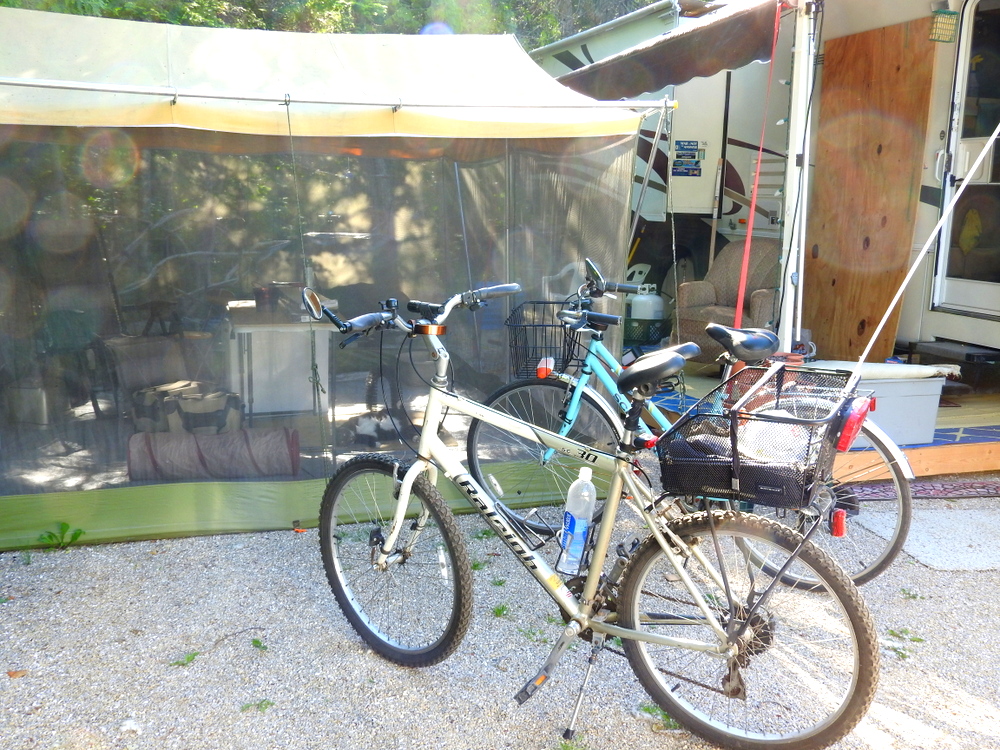 Mark built a deck under our awning, and then we found this screen tent at a garage sale for $10!