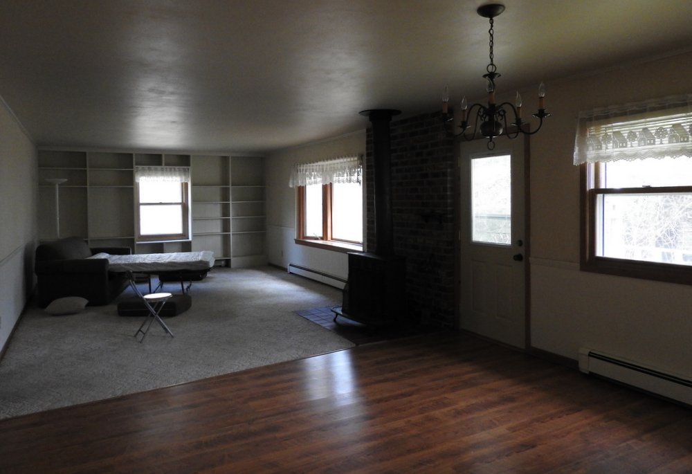 Both the kitchen and the front entry way lead to the dining room and living room.