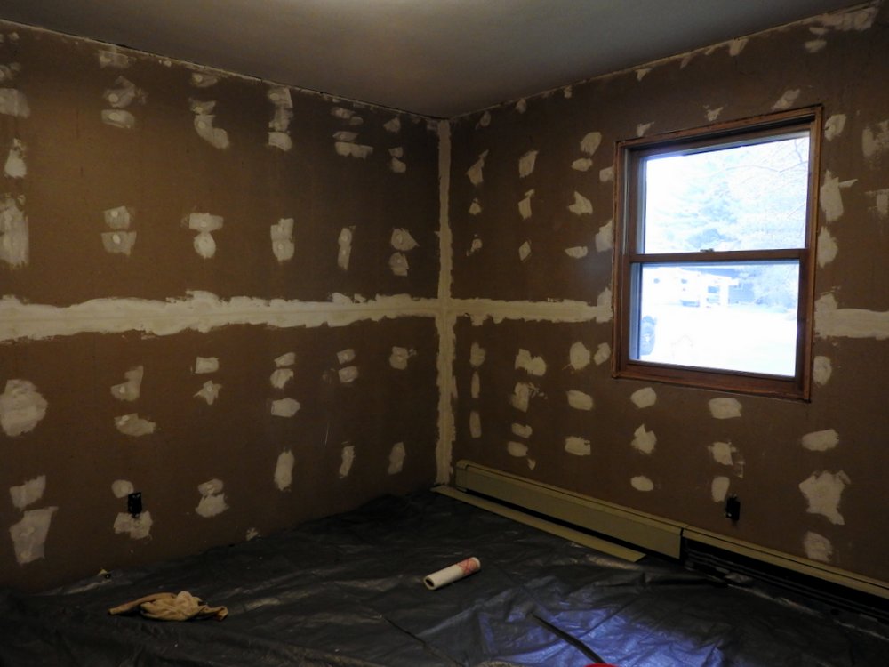 Step one of finishing the bedroom walls.